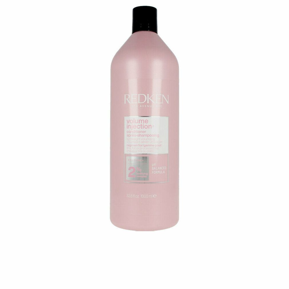 Rosa Flasche mit schwarzem Deckel. Aufkleber mit Produktinformationen. Marke Redken.