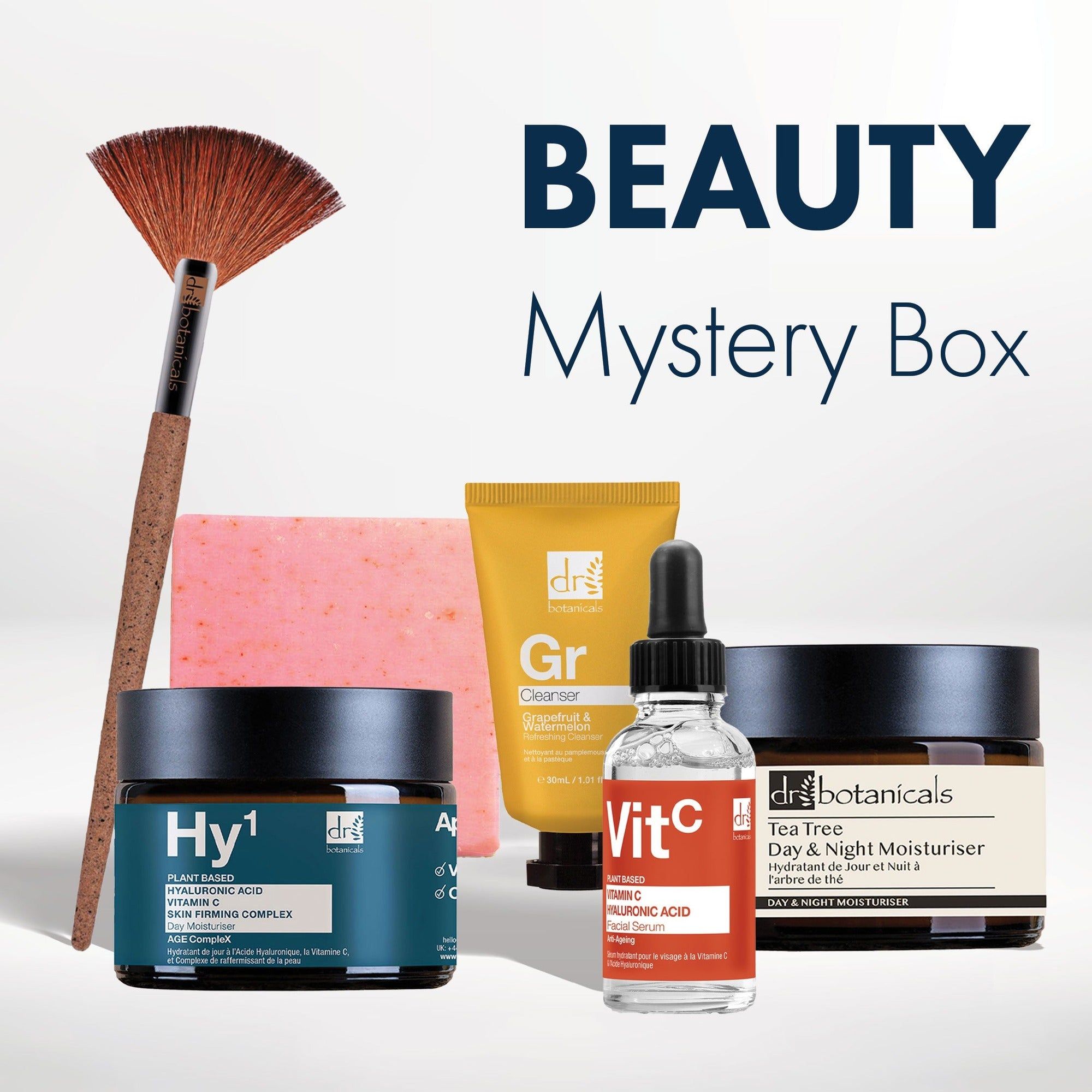Verschiedene Hautpflegeprodukte und ein Pinsel. Produkte mit Etiketten, darunter "Hy1", "Vit C" und "Day & Night Moisturiser".