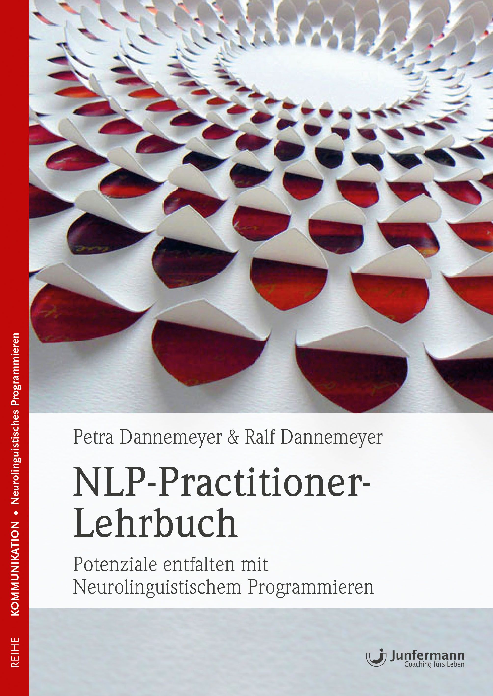 Buchcover mit Titel: NLP-Practitioner-Lehrbuch. Autoren: Petra & Ralf Dannemeyer. Verlag Junfermann. Hintergrund: abstraktes Muster aus Blütenblättern.