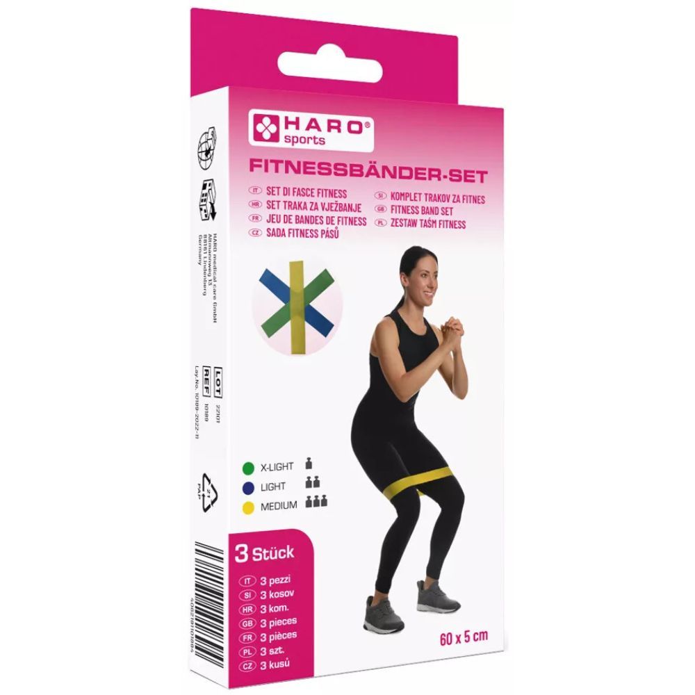 Fitnessbänder-Set in Verpackung. Frau mit gelbem Band. 3 Bänder, grün, blau, gelb. Haro Sports. 60x5 cm.