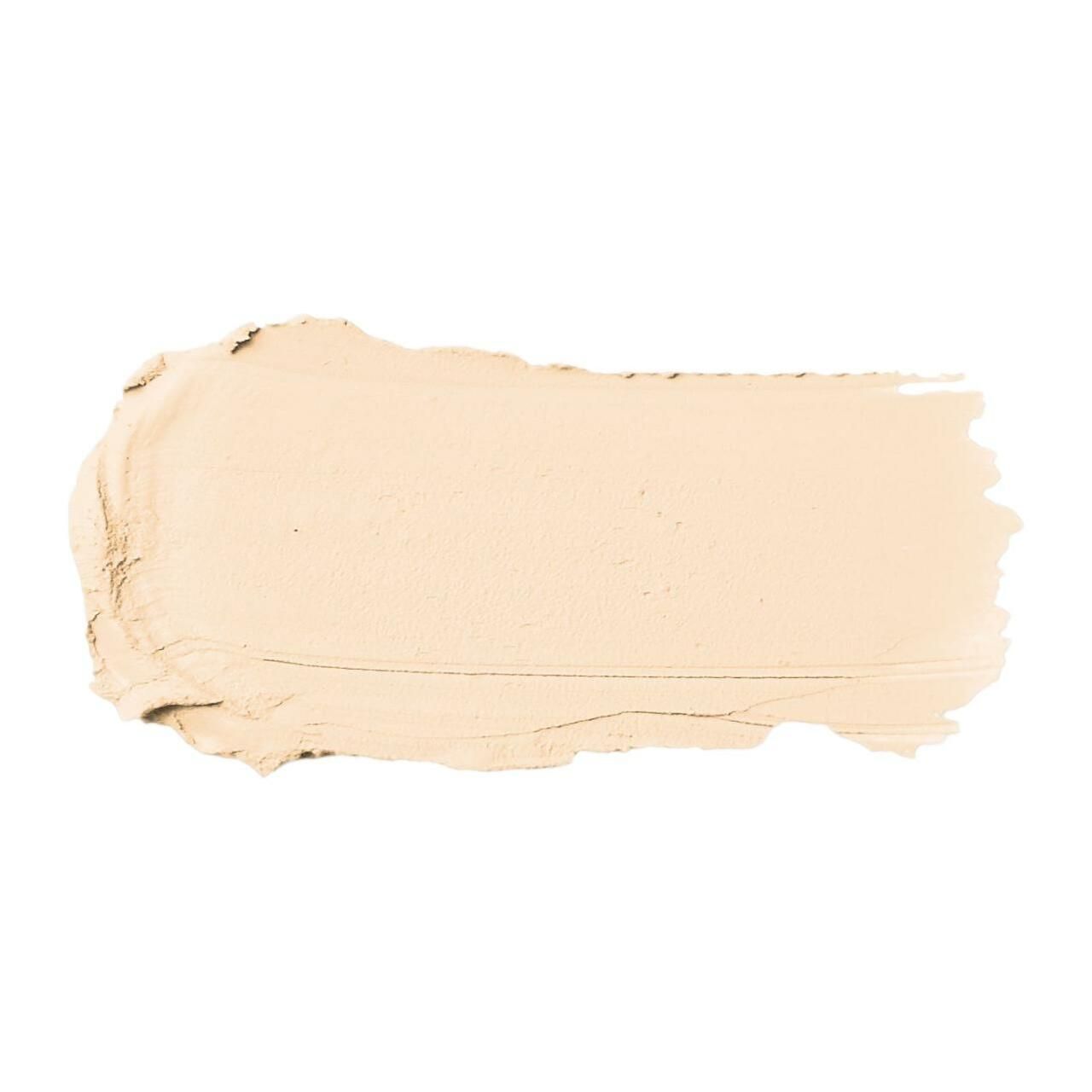 Heller Foundation-Stift-Abstrich. Creme-Textur, helle Farbe. Auf weißem Hintergrund.