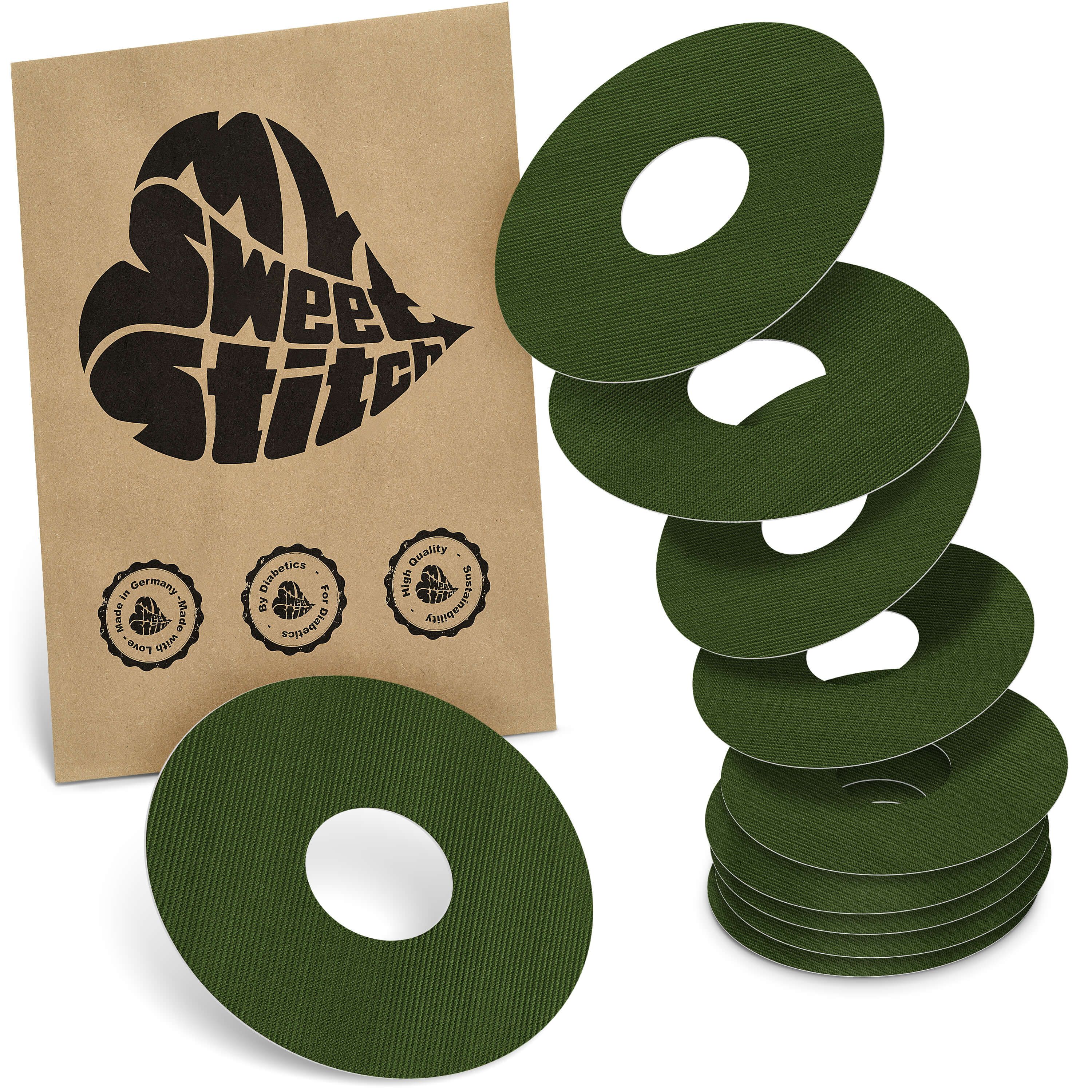 Olivegrüne, runde Pflaster mit Loch. Auf brauner Verpackung steht "My Sweet Stitch". Siegel: Made in Germany, by diabetics, high quality.