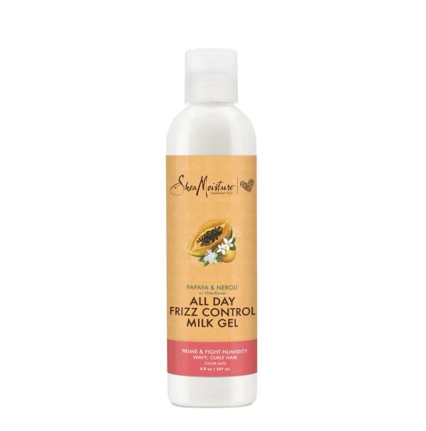 Shea Moisture Milchgel-Flasche. Vorderseite mit Papaya-Illustration und Text. Weißer Deckel, braunes Etikett.