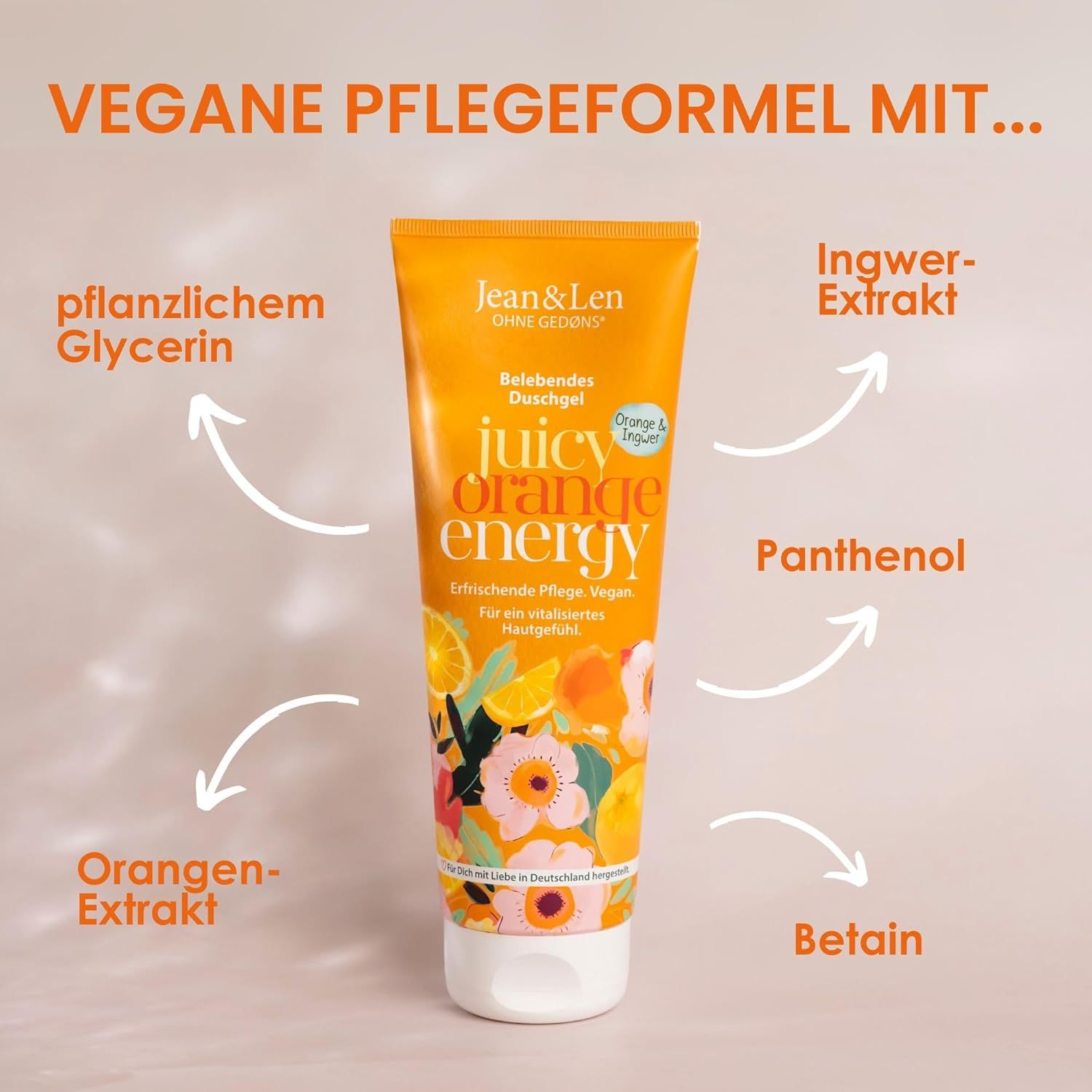Orangefarbene Tube mit Produktnamen und Inhaltsstoff-Pfeilen. Text: Vegane Pflegeformel mit...Glycerin, Ingwer-Extrakt, Panthenol, Betain, Orangen-Extrakt.