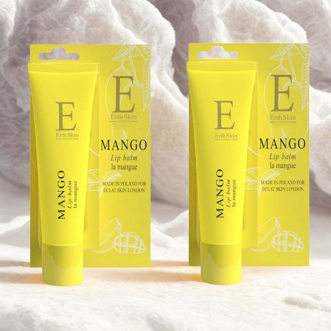 Zwei gelbe Lippenbalsam-Tuben mit Verpackung. Aufschrift: Mango, Eclat Skin London. Gelbe Verpackung mit Mango-Illustration.