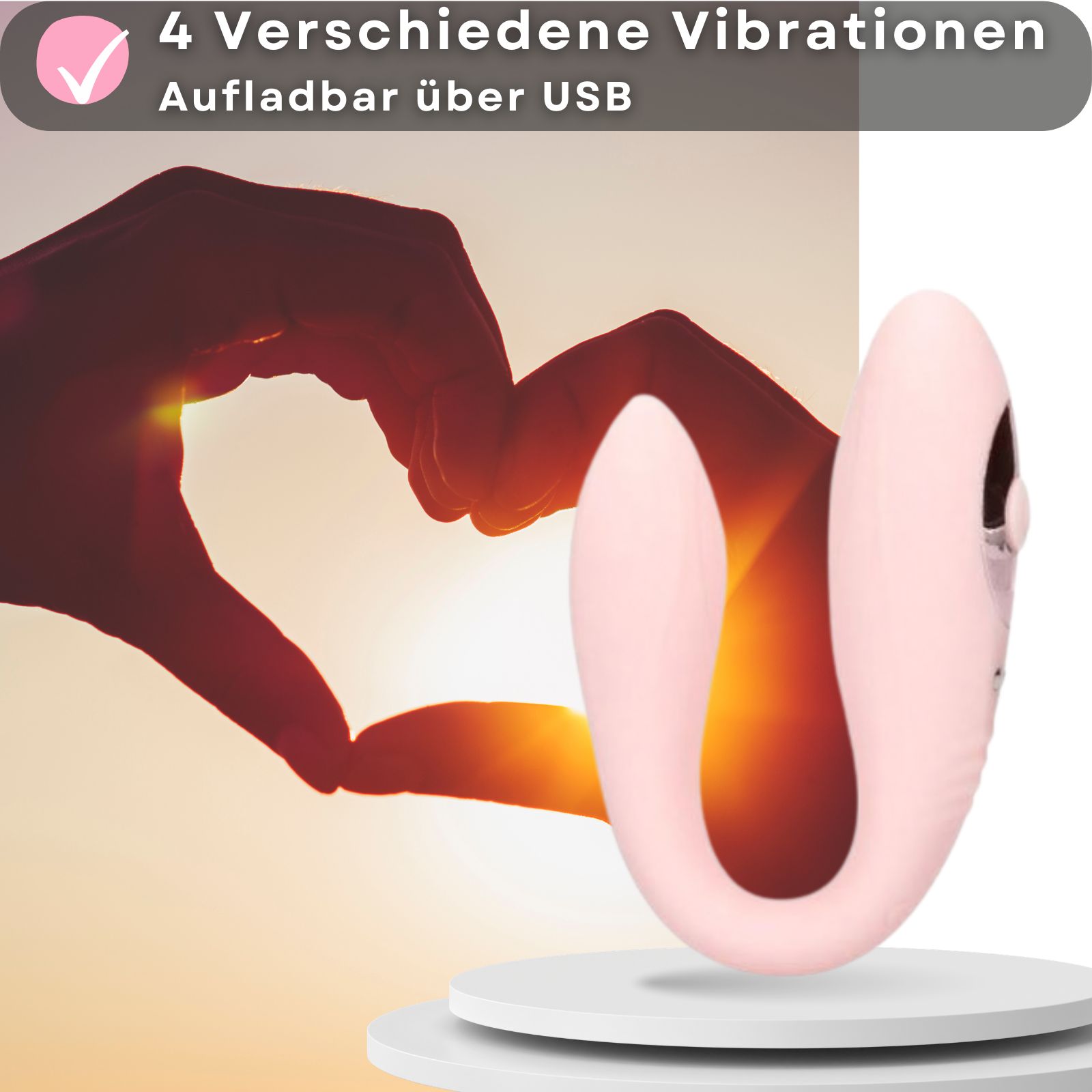 Rosa Partner-Vibrator. 4 Vibrationsmodi. Aufladbar über USB. Herz-Silhouette im Hintergrund.
