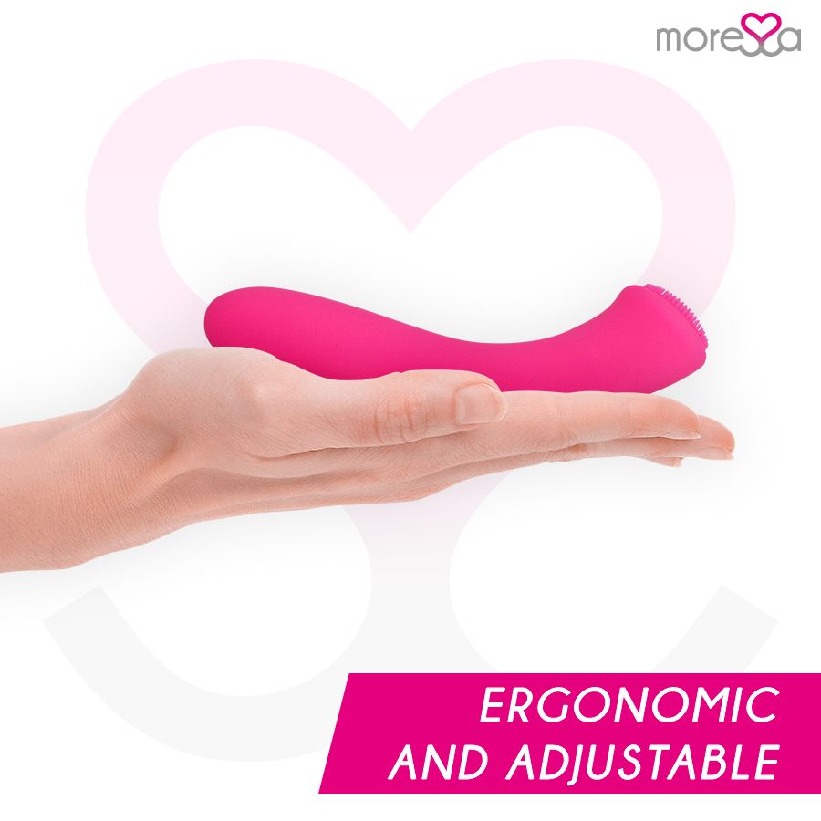 Pinker Silikon-Vibrator mit Bürstenkopf wird in einer Hand gehalten, ergonomische Form.