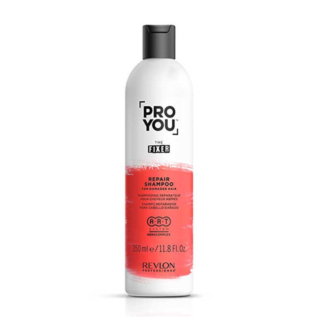 Weiße Flasche mit schwarzem Deckel. Aufschrift: PRO YOU THE FIXER REPAIR SHAMPOO. 350ml/11.8 Fl. Oz. Revlon Professional.