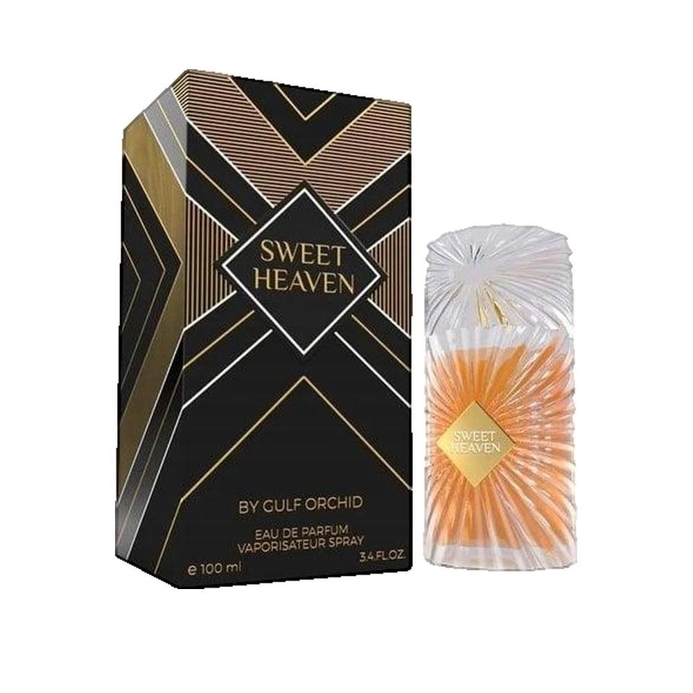 Parfumflakon und Schachtel. Flakon mit goldfarbener Flüssigkeit, goldfarbenem Etikett. Schwarze Schachtel mit goldenen geometrischen Mustern und Text.