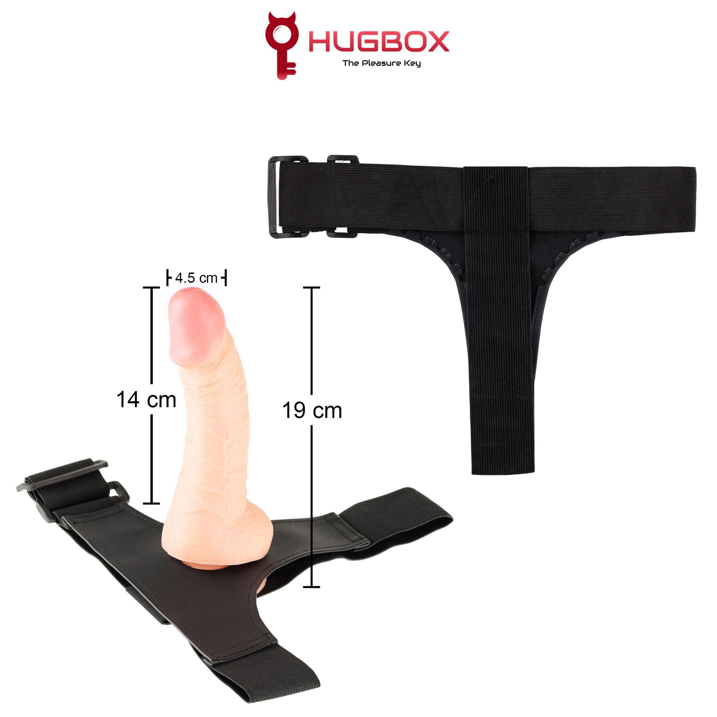 Dildo mit Harness. Maße: 14 cm Dildo, 19 cm Harness. Schwarzer Harness mit verstellbaren Gurten. HUGBOX Logo.