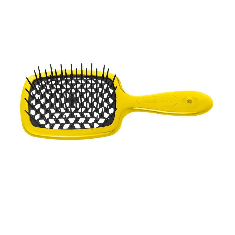 Gelbe Haarbürste mit schwarzem Borstenfeld. Der Griff hat eine ovale Form. Das Produkt ist auf weißem Hintergrund abgebildet.