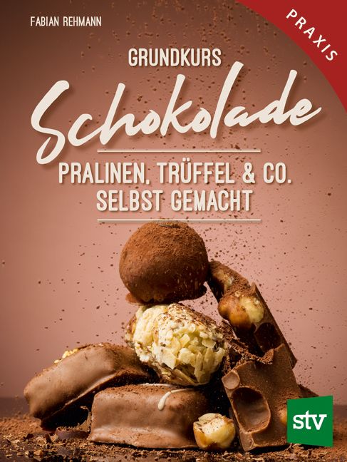 Buchcover: "Grundkurs Schokolade". Titel in großer Schrift, darunter "Pralinen, Trüffel & Co. selbst gemacht". Schokoladenstücke und Pralinen.
