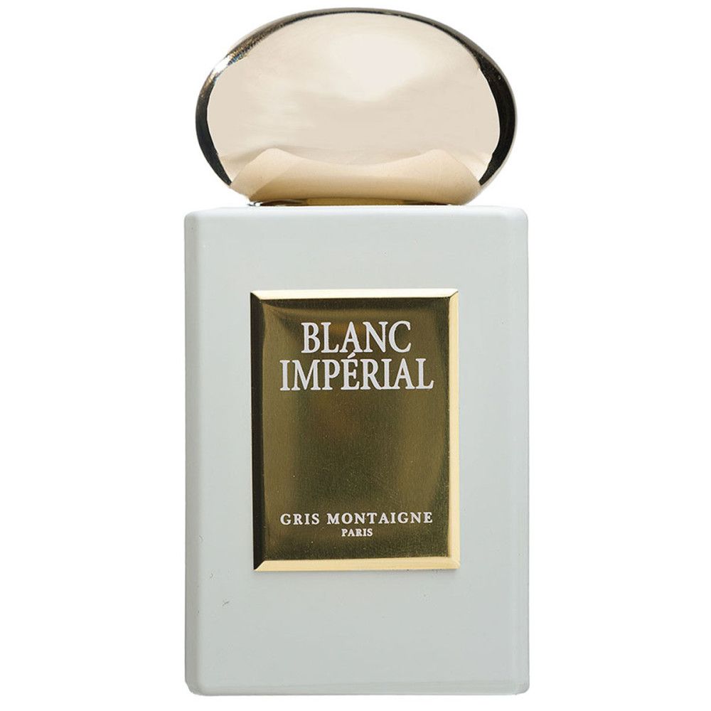 Rechteckiger Flakon mit goldfarbenem Verschluss. Aufschrift "BLANC IMPÉRIAL" und "GRIS MONTAIGNE PARIS" auf goldenem Etikett.