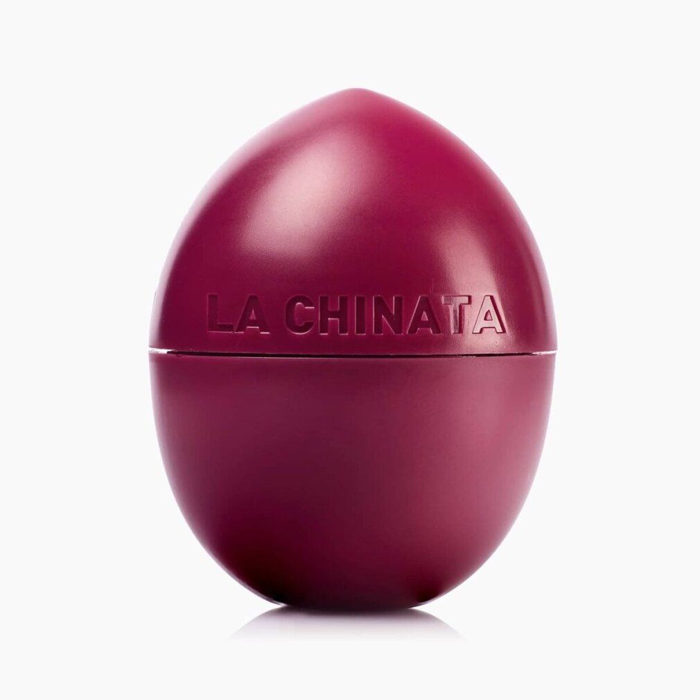 Kirschfarbener Lippenbalsam in Eiform. Aufschrift: La Chinata. Deckel und Behälter sind geteilt.