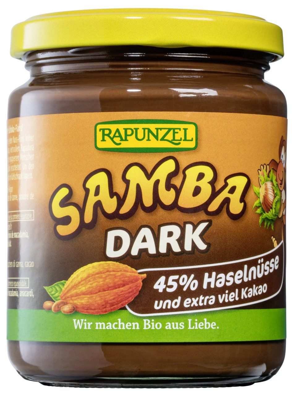 Rapunzel Samba Dark Schoko-Nuss-Aufstrich im Glas mit gelbem Deckel, Haselnüssen und Kakao abgebildet.