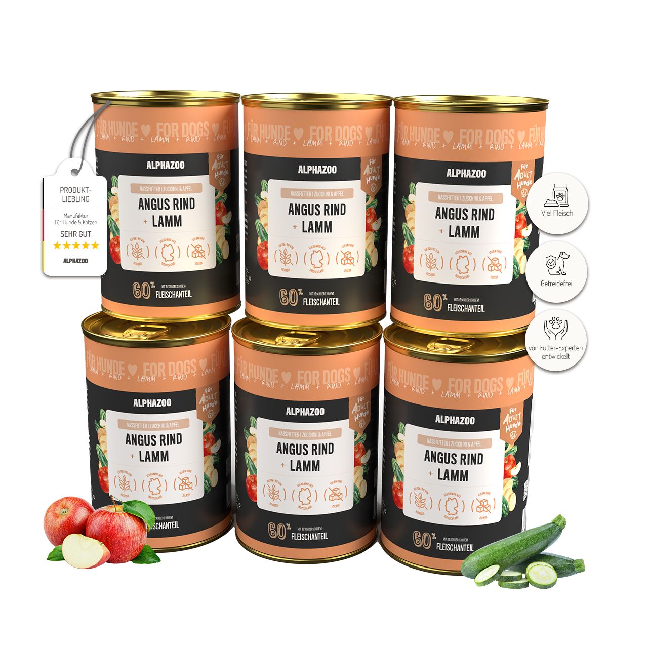 Sechs Dosen Nassfutter für Hunde, Angus Rind + Lamm. Aufschrift: ALPHAZOO, 80% Fleischanteil. Äpfel und Zucchini liegen daneben.