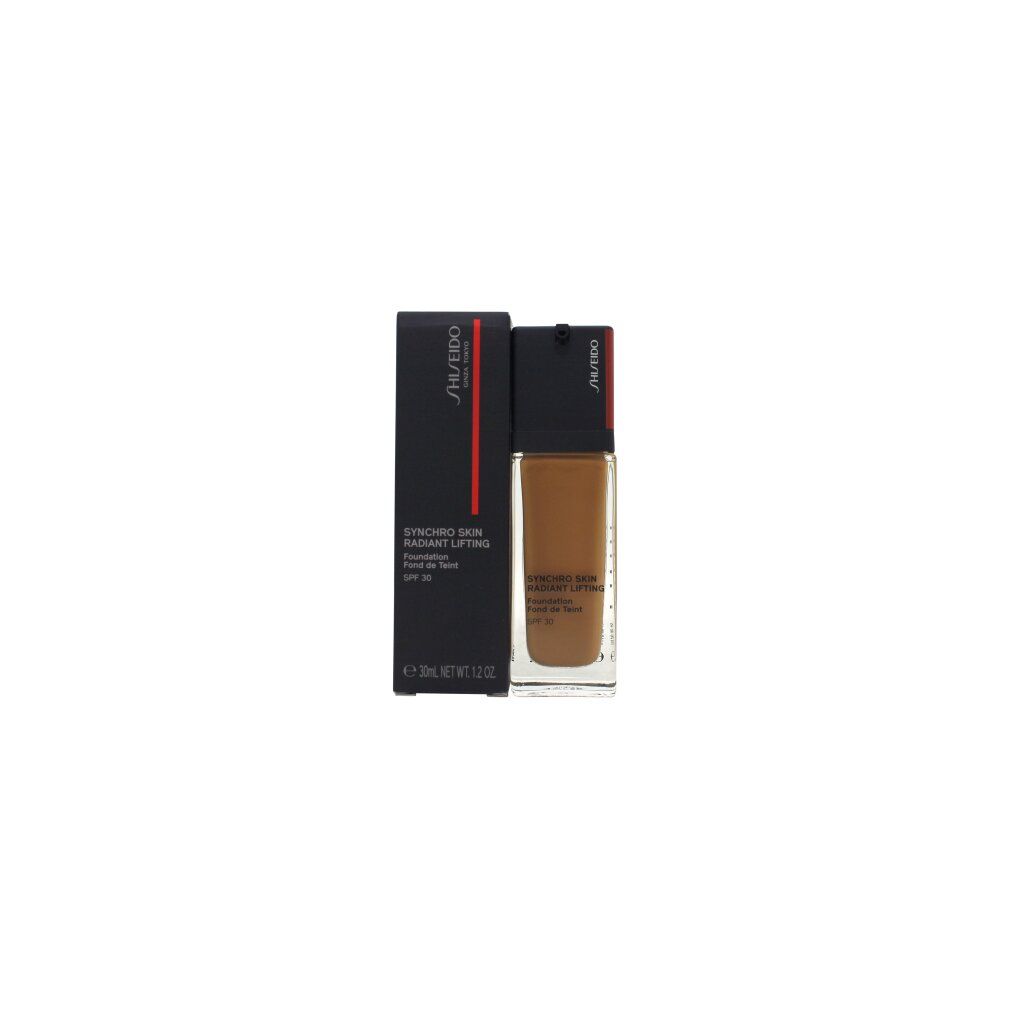 Shiseido Synchro Skin Radiant Lifting Foundation mit Verpackung. Schwarze Schachtel, Flasche mit braunem Inhalt.