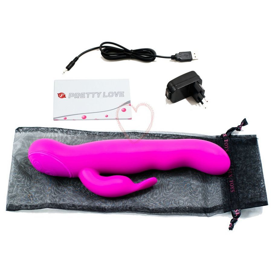 Lila Vibrator mit Zubehör: Ladekabel, Netzteil, Beutel und Karte.