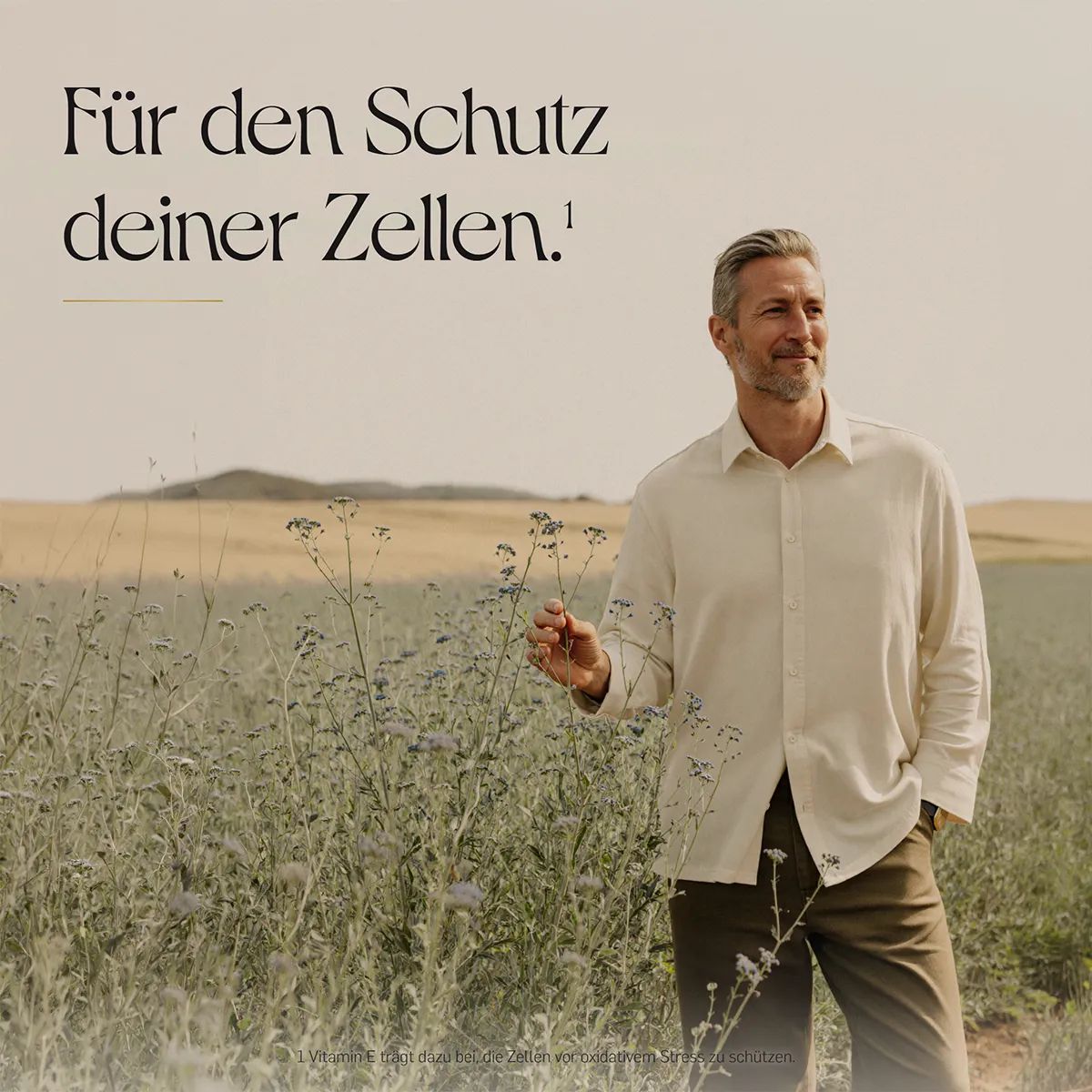 Mann in einem Feld, Text über Zellschutz.