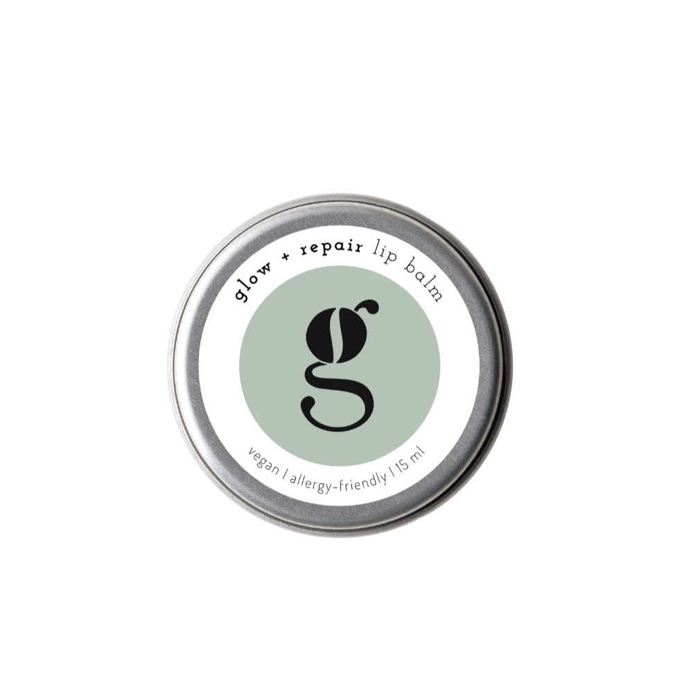 Runder Tiegel mit Deckel. Auf dem Deckel steht "glow + repair lip balm". In der Mitte ein grüner Kreis mit einem schwarzen "g".