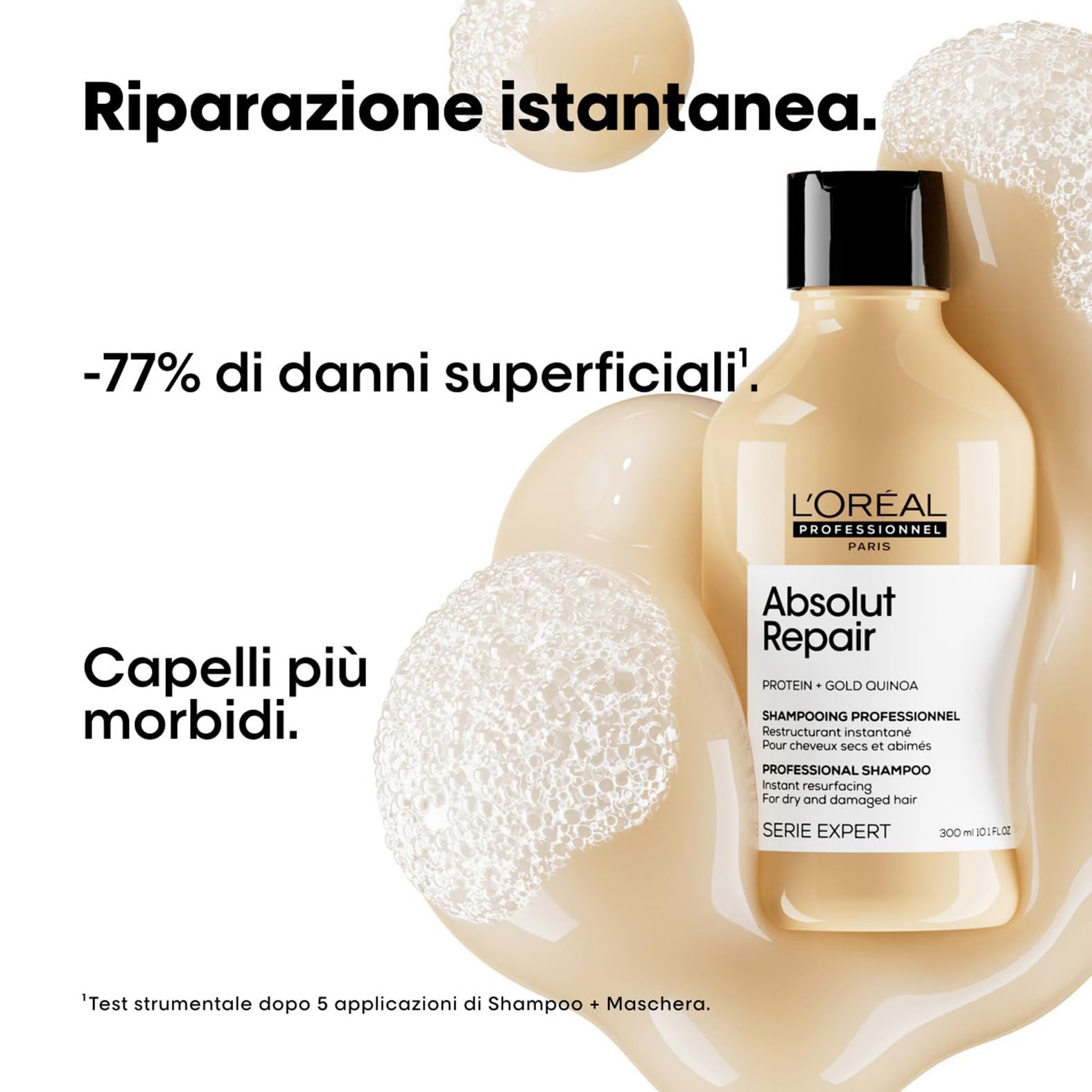 Shampoo-Flasche, Schaum und Text: -77% Oberflächenschäden. L'Oréal Professionnel Absolut Repair.