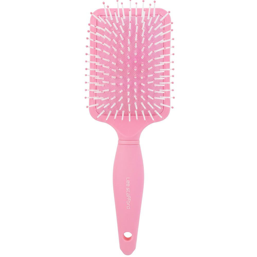 Rosa Paddle Brush mit weißen Borsten. Griff mit Markennamen und Loch. Rechteckiger Bürstenkopf.