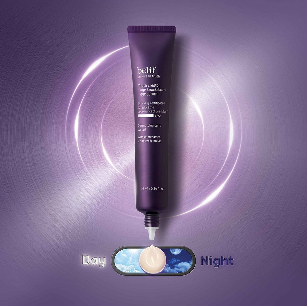 Belif Augencreme-Tube mit aufgetragener Creme. Tag/Nacht-Schalter-Grafik. Lila Hintergrund mit Ringen.