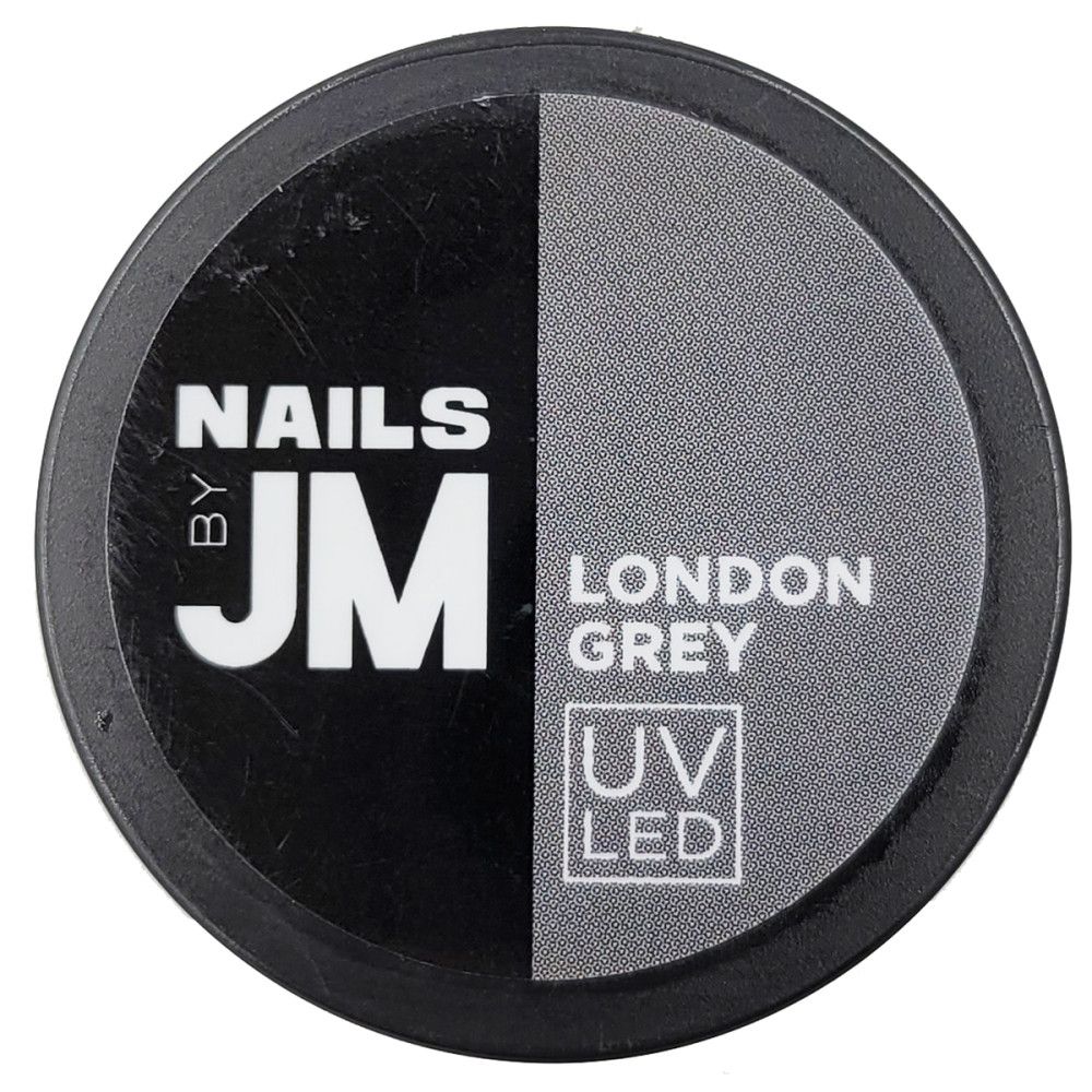 Runder Behälter, geteilt in Schwarz und Grau. Aufschrift "NAILS BY JM", darunter "LONDON GREY" und "UV LED".