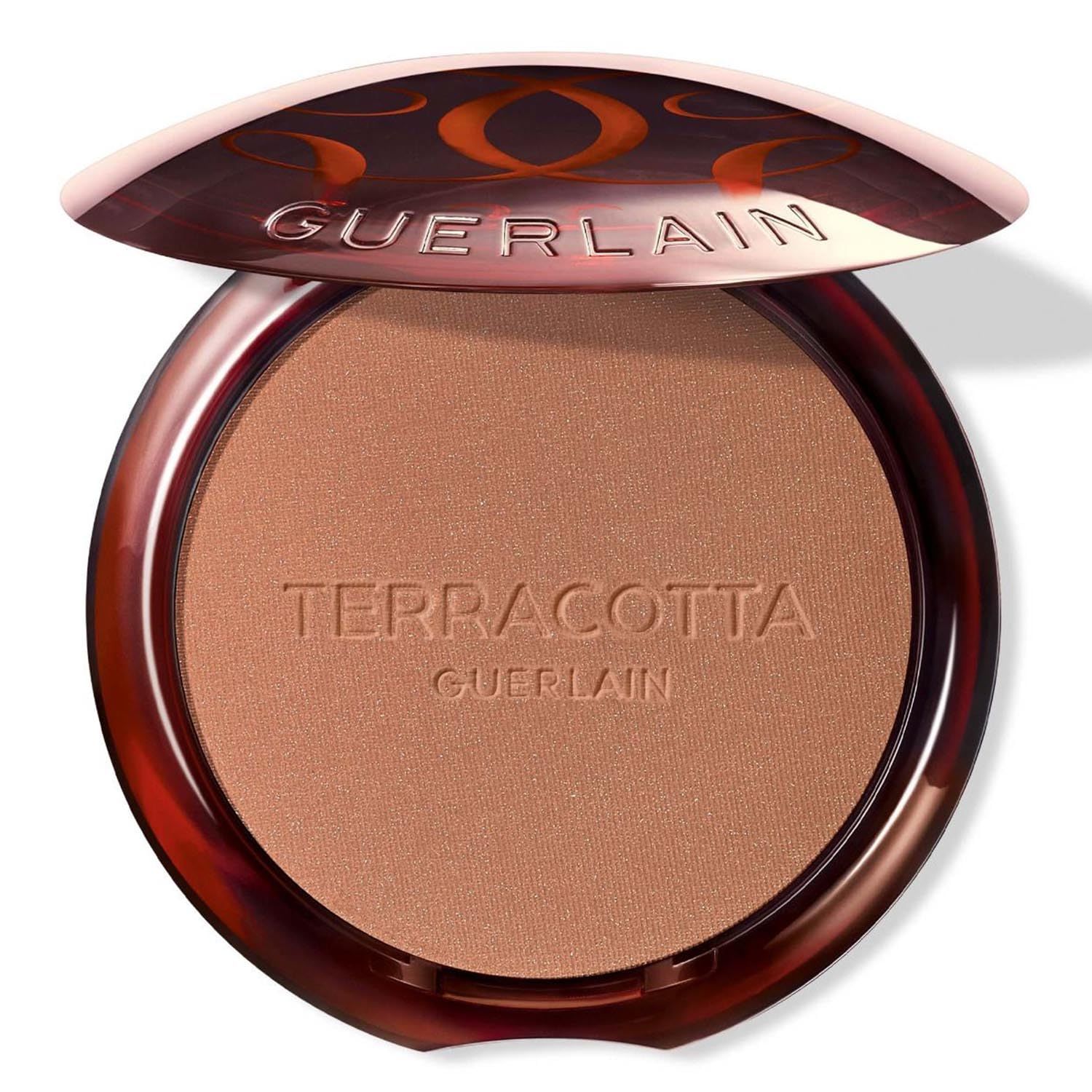 Kompaktpuder mit Schriftzug Terracotta Guerlain. Runde, braune Dose mit geöffnetem Deckel. Brauner Puder sichtbar.