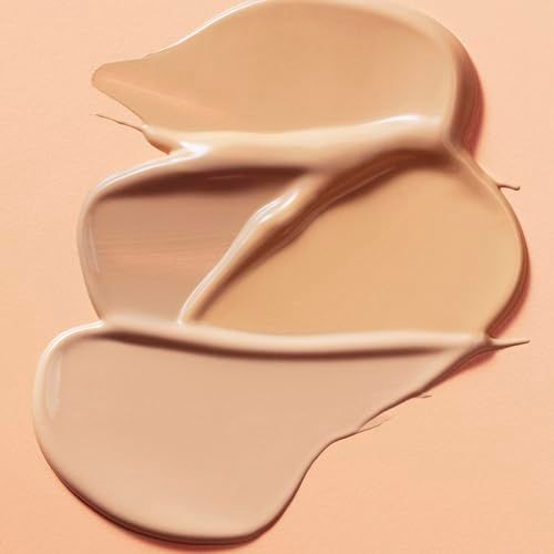 Drei Farbtöne Concealer auf beigem Hintergrund. Verschiedene Farbtöne.