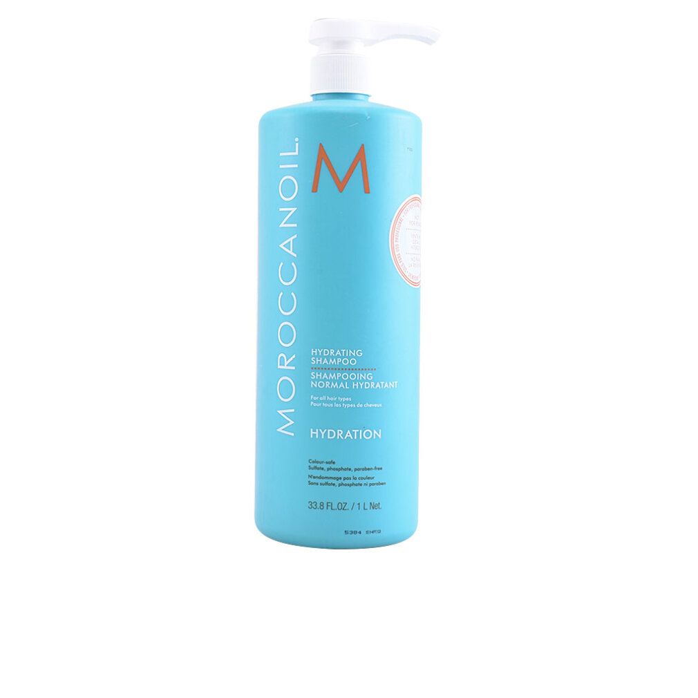 Türkisgrüne Flasche mit weißem Pumpkopf. Aufschrift: Moroccanoil, Hydrating Shampoo. Orangefarbenes Logo.