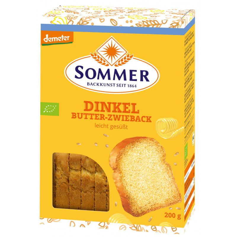 Gelbe Verpackung mit Sommer Dinkel Butter-Zwieback. Sichtfenster mit Zwieback. Demeter-Logo. Aufschrift: leicht gesüßt, 200g.