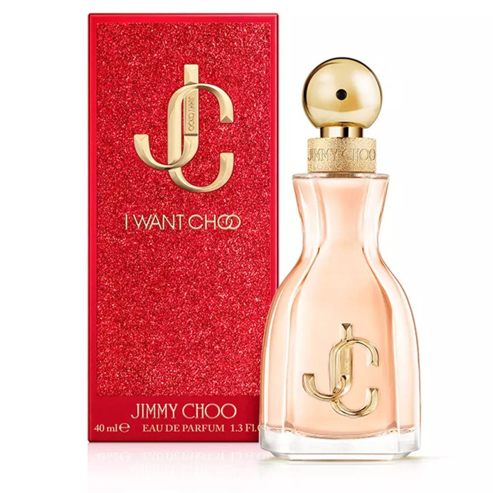 Parfümflasche neben roter Verpackung. Flasche mit goldenem Verschluss und Logo. Verpackung mit "I WANT CHOO" und "JIMMY CHOO".
