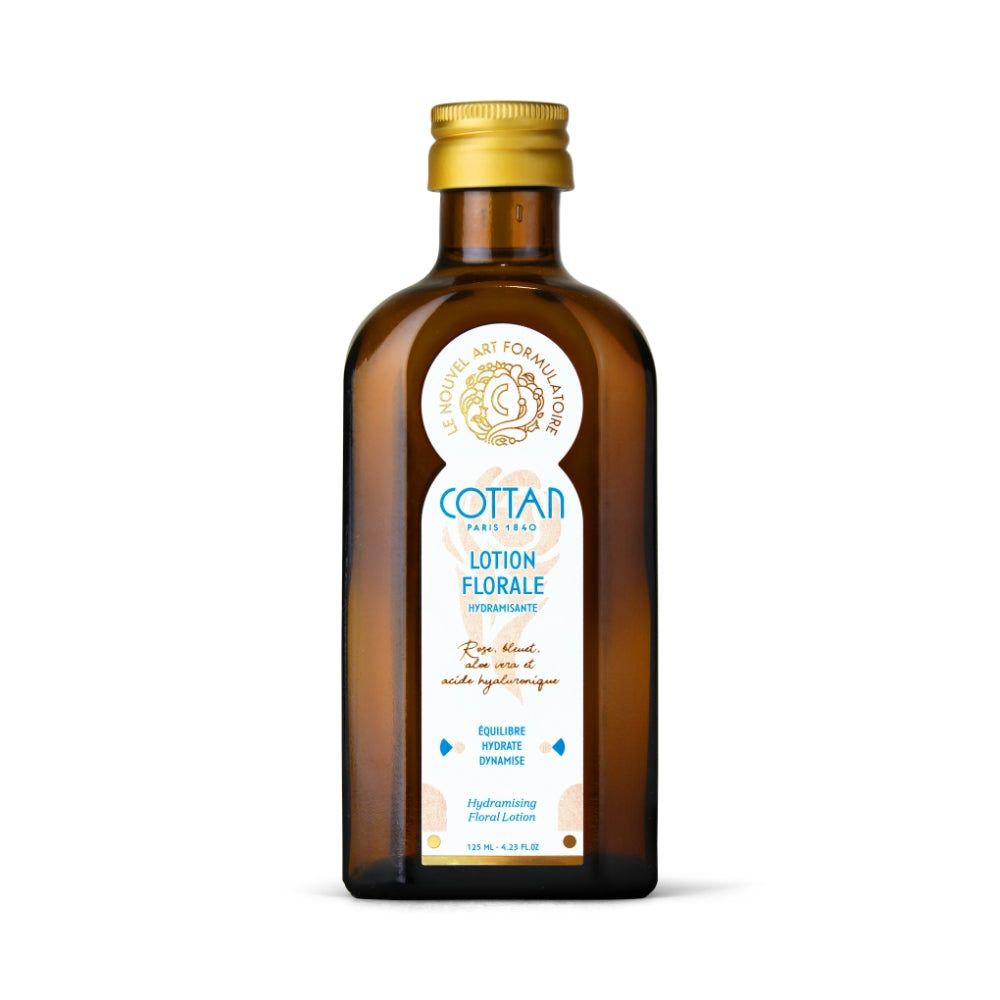 Braune Glasflasche mit goldenem Deckel und "COTTAN"-Logo. Text: "Lotion Florale hydratante".