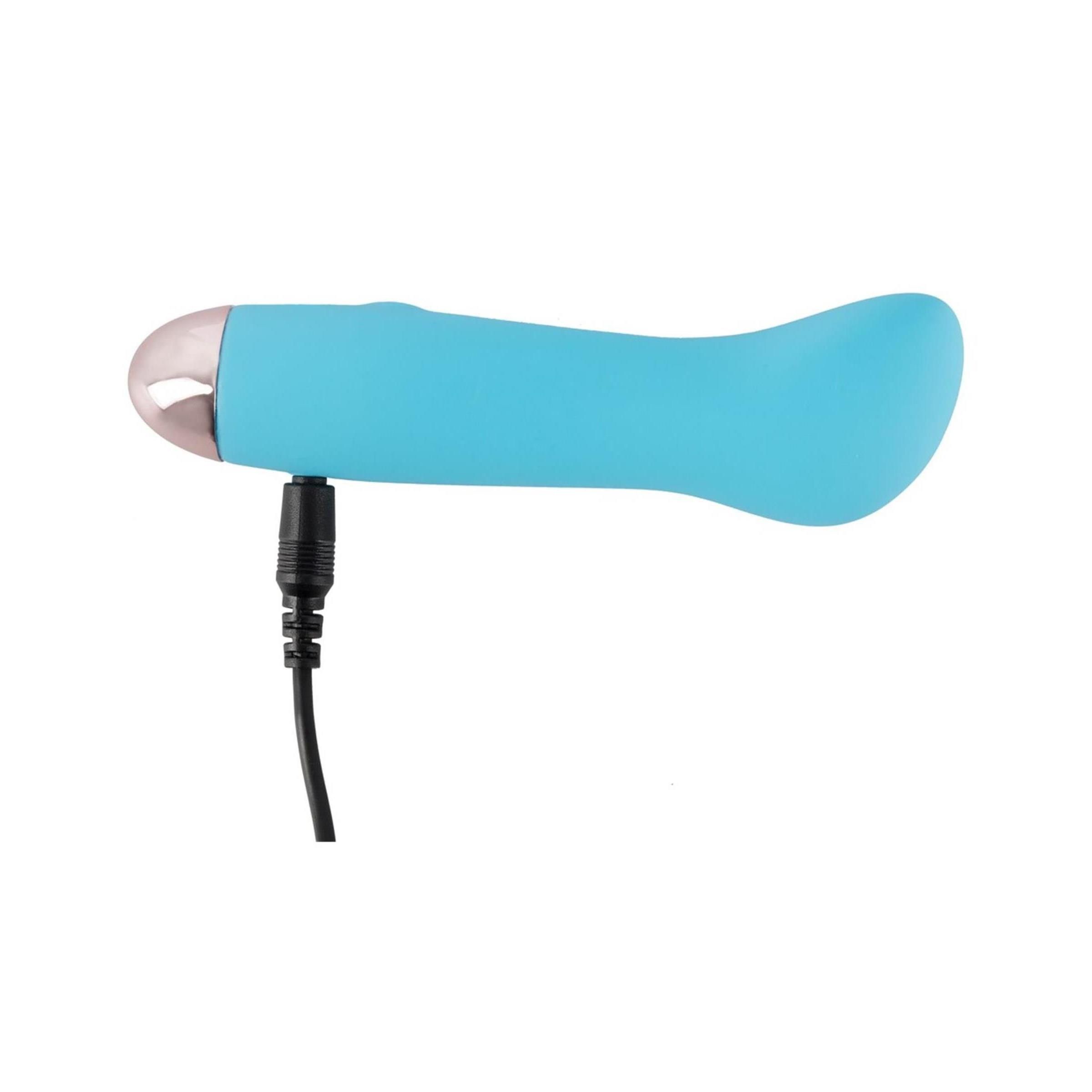 Blauer Vibrator mit angeschlossenem Kabel. Rosa Spitze.