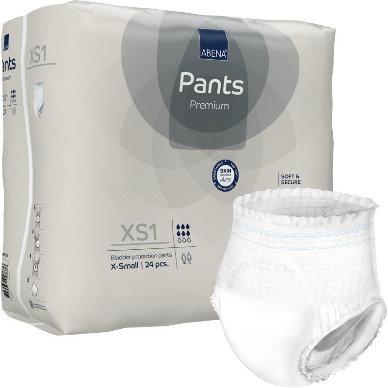 Weiße Inkontinenzhose XS1 mit Verpackung. Verpackung mit Produktname, Marke und Größenangabe. Einzelne Hose daneben.