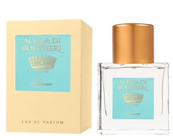 Flakon und Verpackung von Acqua di Bolgheri Scirocco EdP. Rechteckiger Flakon mit goldfarbenem Deckel. Hellgelbe Verpackung mit türkisfarbenem Etikett.