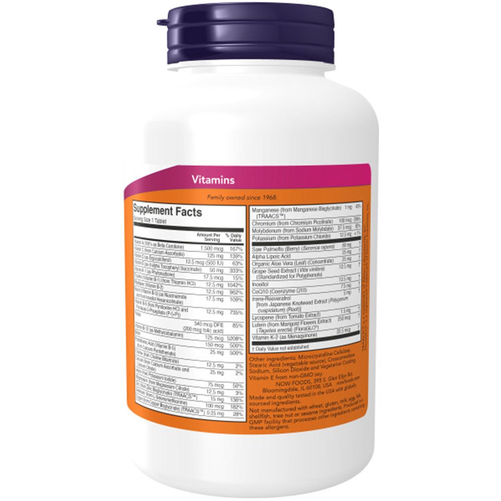 Rückseite der weißen Flasche. Enthält Nährwertangaben und Inhaltsstoffe. "NOW"-Logo. Orangefarbener Streifen. Text in mehreren Sprachen.