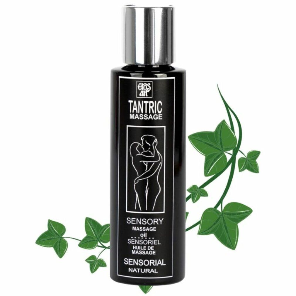 Schwarze Flasche mit silbernem Deckel. Aufschrift: Tantric Massage, Sensory Massage Oil. Grünpflanze im Hintergrund.