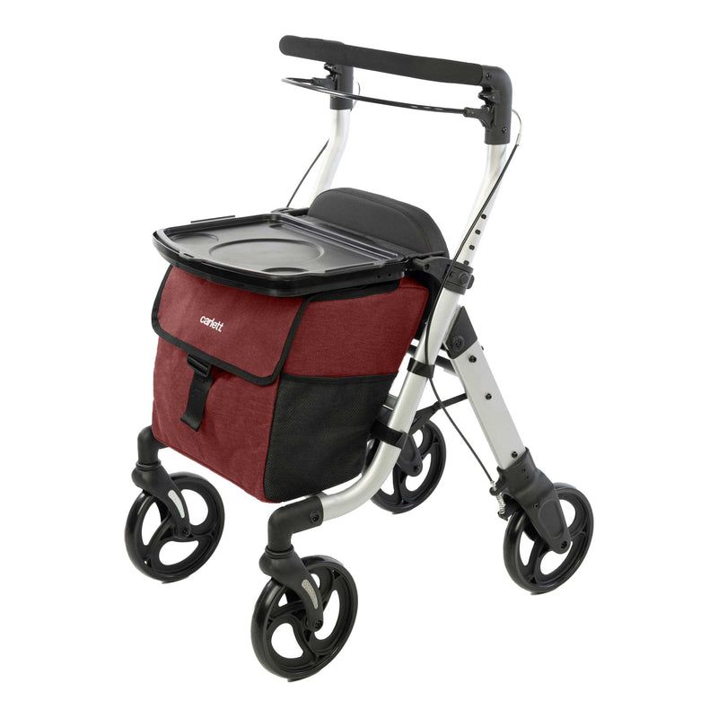 Gehhilfe mit Einkaufstasche und Tablett. Silberner Rahmen, rote und schwarze Tasche.