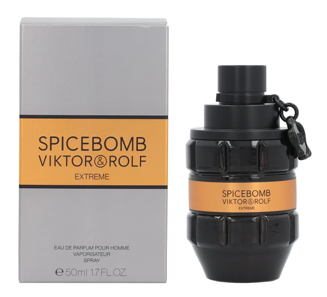 Schwarzer Flakon mit goldfarbenem Band. Aufschrift: SPICEBOMB VIKTOR&ROLF EXTREME. Graue Verpackung daneben.