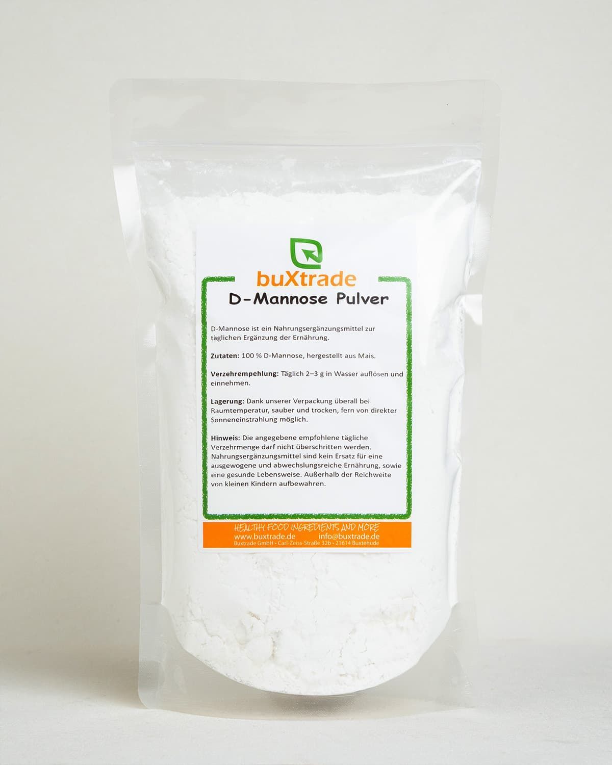 Bag of buxtrade D-Mannose powder with product information label.