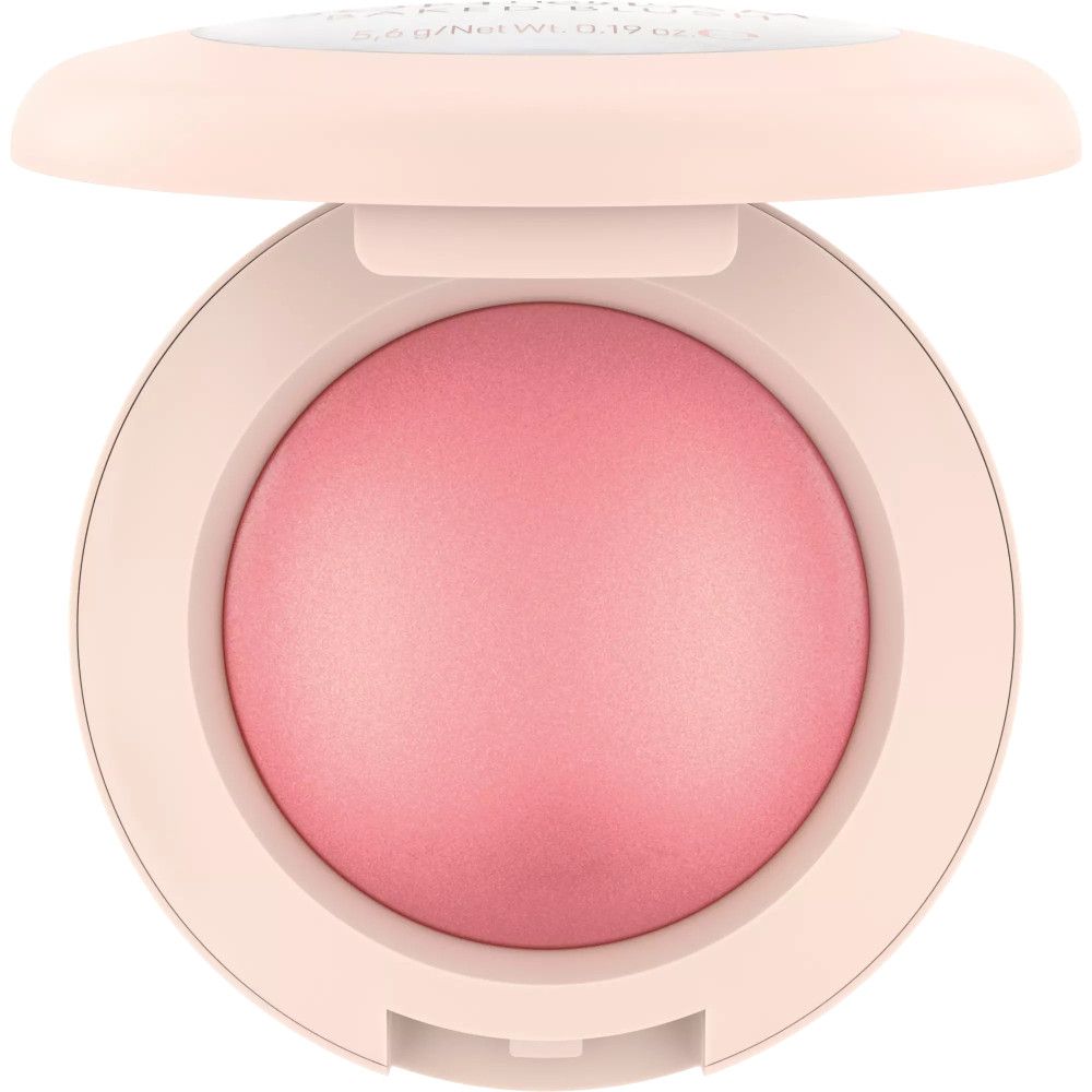 Runder Rouge-Behälter, geöffnet. Rosa Puder im Inneren. Hellrosa Verpackung. Aufschrift oben.