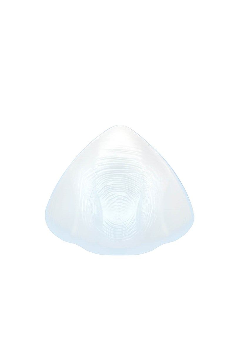 Transparente, tropfenförmige Silikon-Epithese. Oberseite glatt, Unterseite mit feinen Rillen. Dreieckige Form.