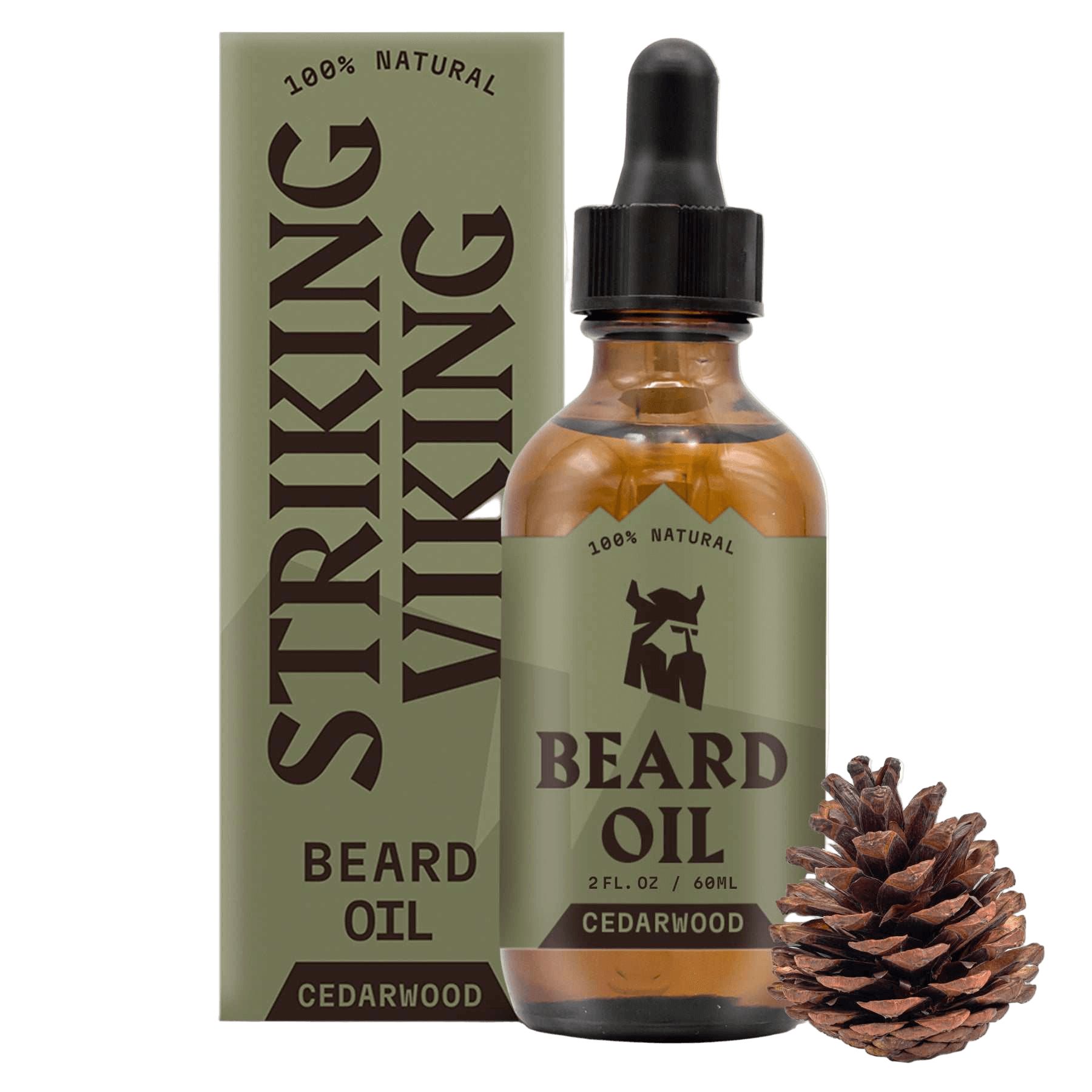 Braunes Bartöl-Fläschchen mit Pipette, neben einer Verpackung und einem Tannenzapfen. Aufschrift: "STRIKING VIKING BEARD OIL CEDARWOOD".