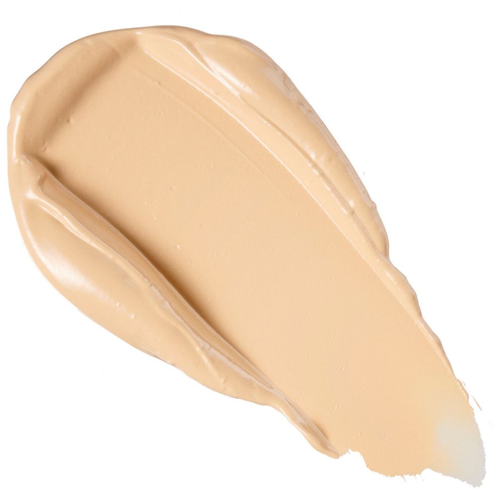 Heller Concealer-Swirl auf weißem Hintergrund. Cremige Textur, Farbton hell.