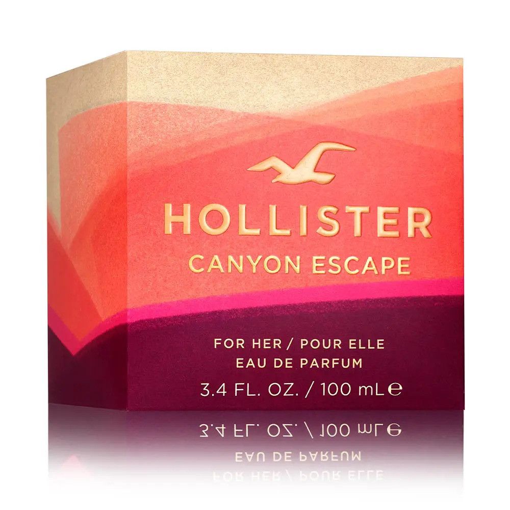 Hollister Canyon Escape Eau de Parfum Spray-Verpackung. Farbverlauf von Rot- und Beigetönen. Logo und Produktname in Gold.