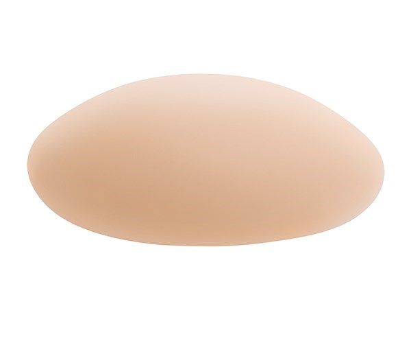 Prothese in Hautfarbe. Elliptische Form. Glatte Oberfläche. Für medizinische Zwecke.