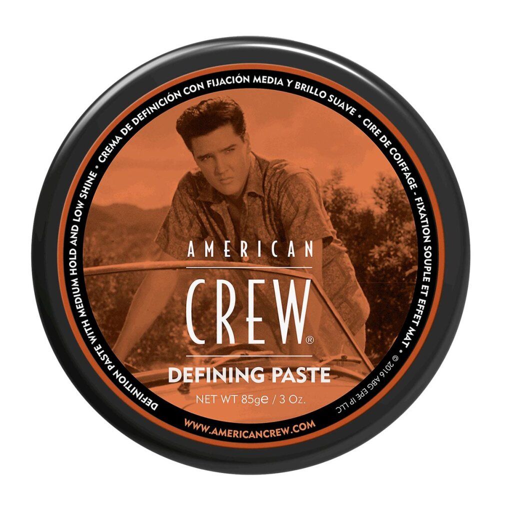 Runde, schwarze Dose mit Elvis-Bild und Schriftzug "American Crew Defining Paste". Orangefarbener Deckel mit Text.