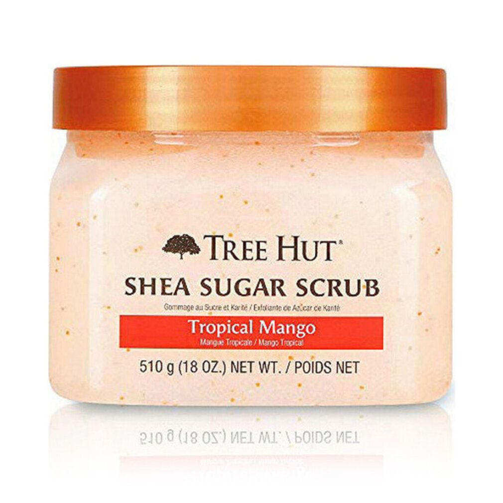 Tree Hut Shea Sugar Scrub Tropical Mango in einem transparenten Behälter mit orangefarbenem Deckel.